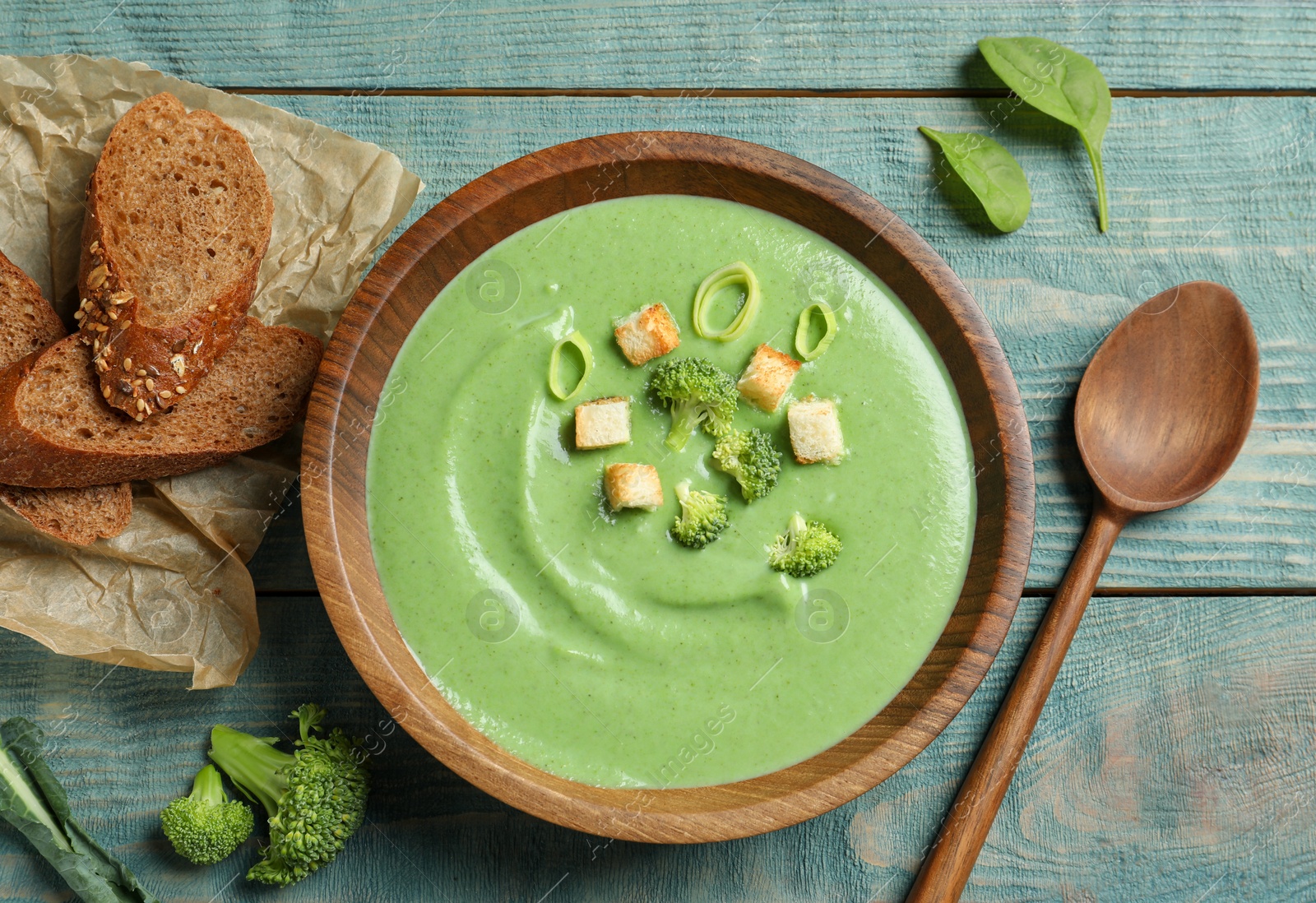 Photo of Fresh vegetable detox soup made of broccoli served on table, top view