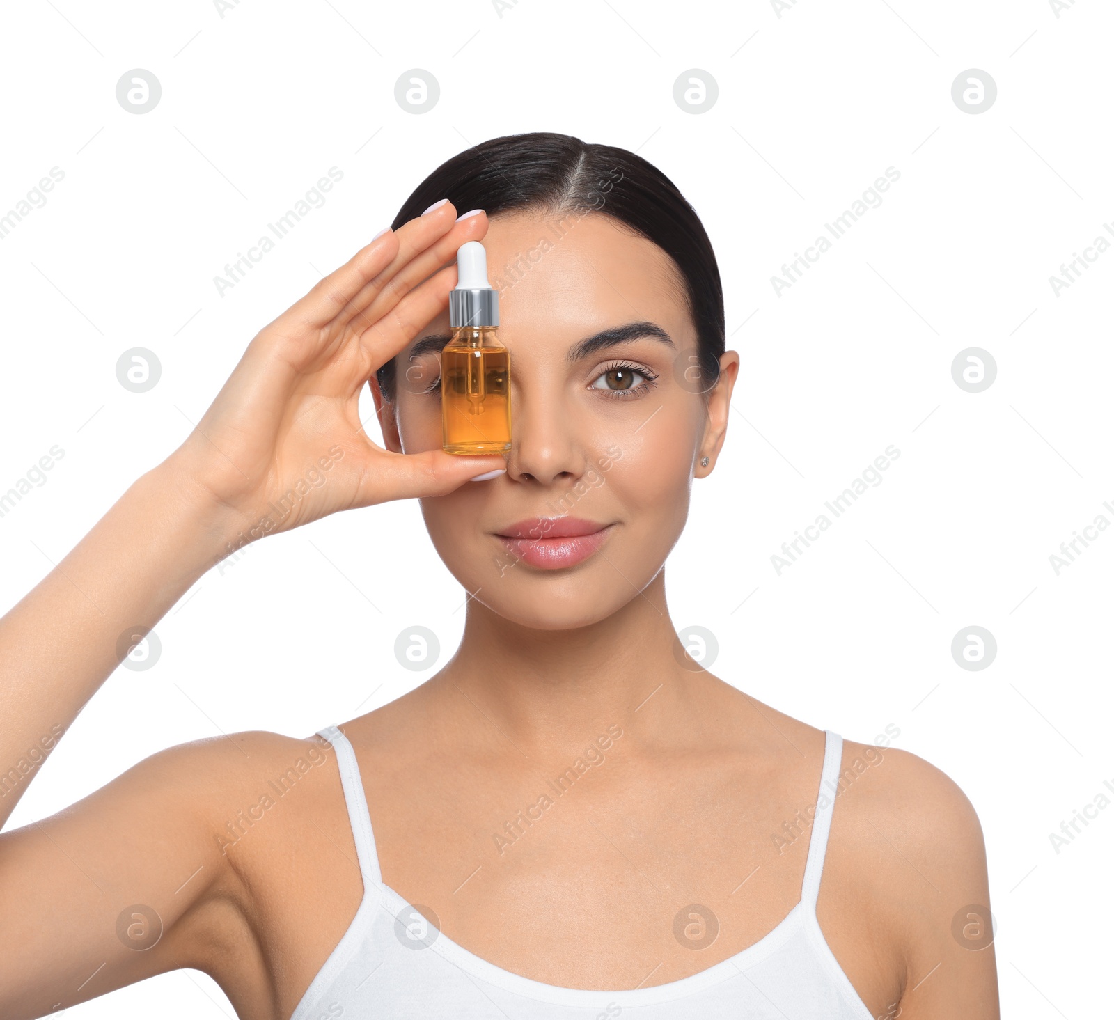 Photo of Young woman with bottle of essential oil on white background