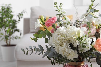 Beautiful bouquet of different fresh flowers indoors, closeup