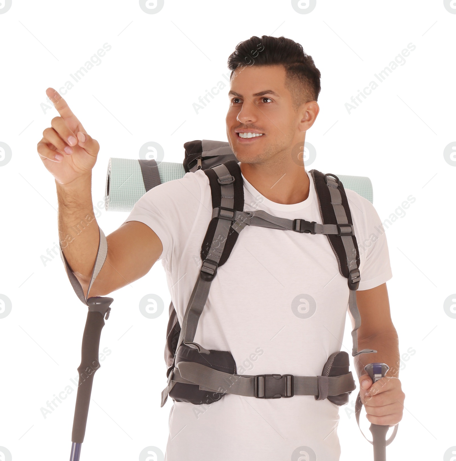 Photo of Male hiker with backpack and trekking poles on white background