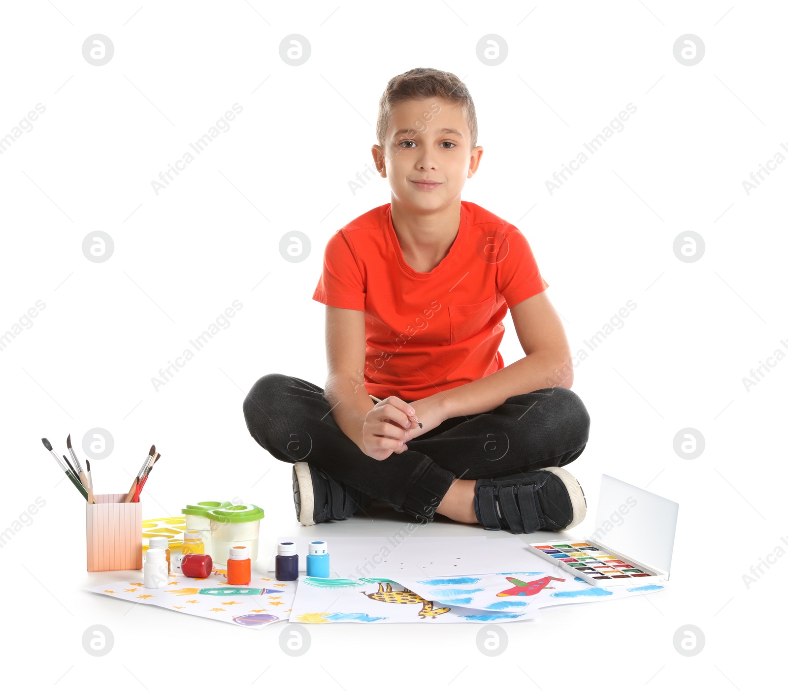 Photo of Cute child painting picture on white background