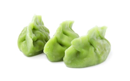 Delicious green dumplings (gyozas) isolated on white