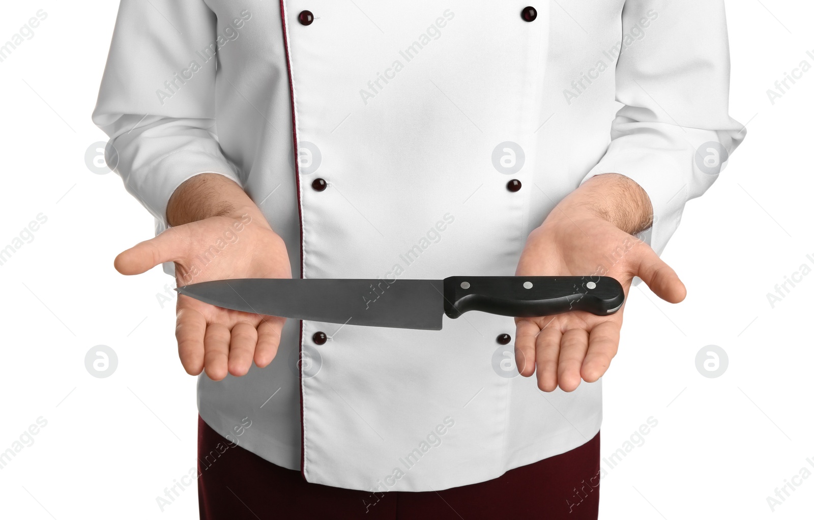 Photo of Chief cook holding clean sharp knife on white background, closeup