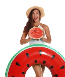 Beautiful young woman with inflatable ring and watermelon on white background