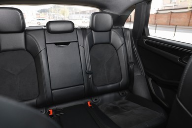 Photo of Clean leather seats inside of modern black car