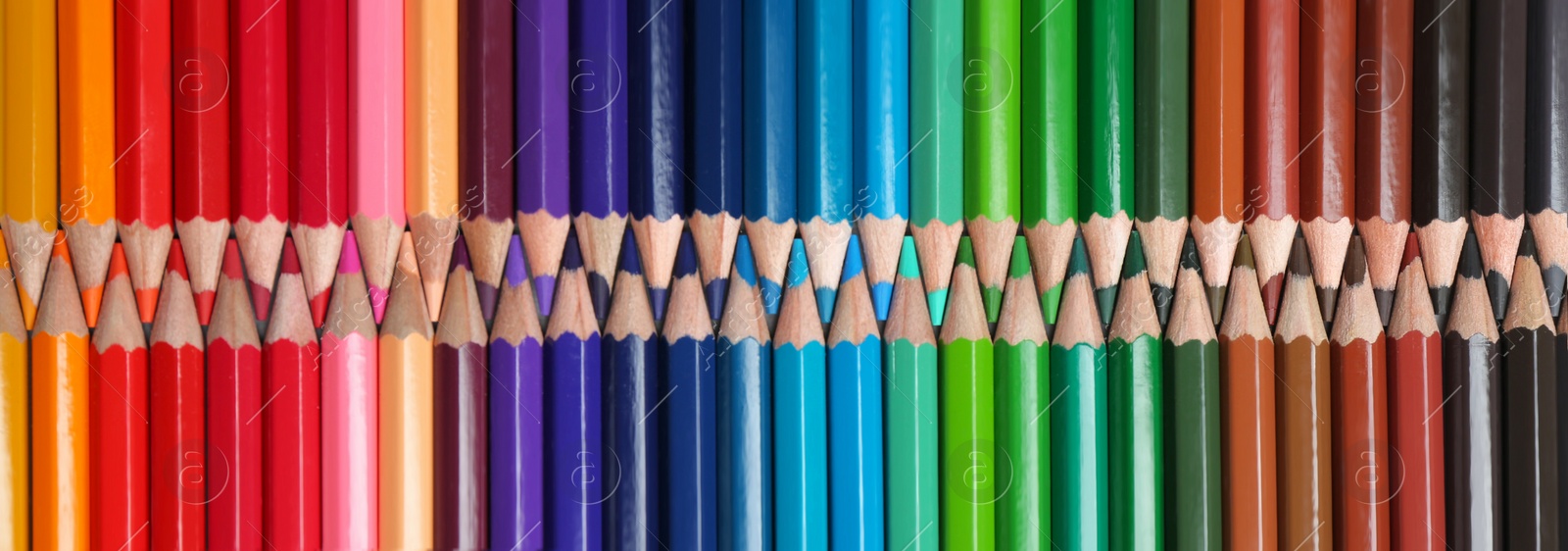 Photo of Set of colorful pencils as background, top view