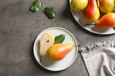 Flat lay composition with ripe pears on grey background