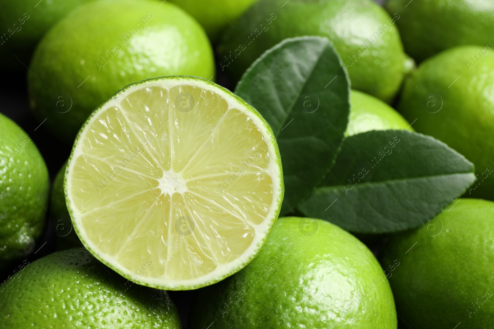 Photo of Fresh ripe juicy limes as background, closeup