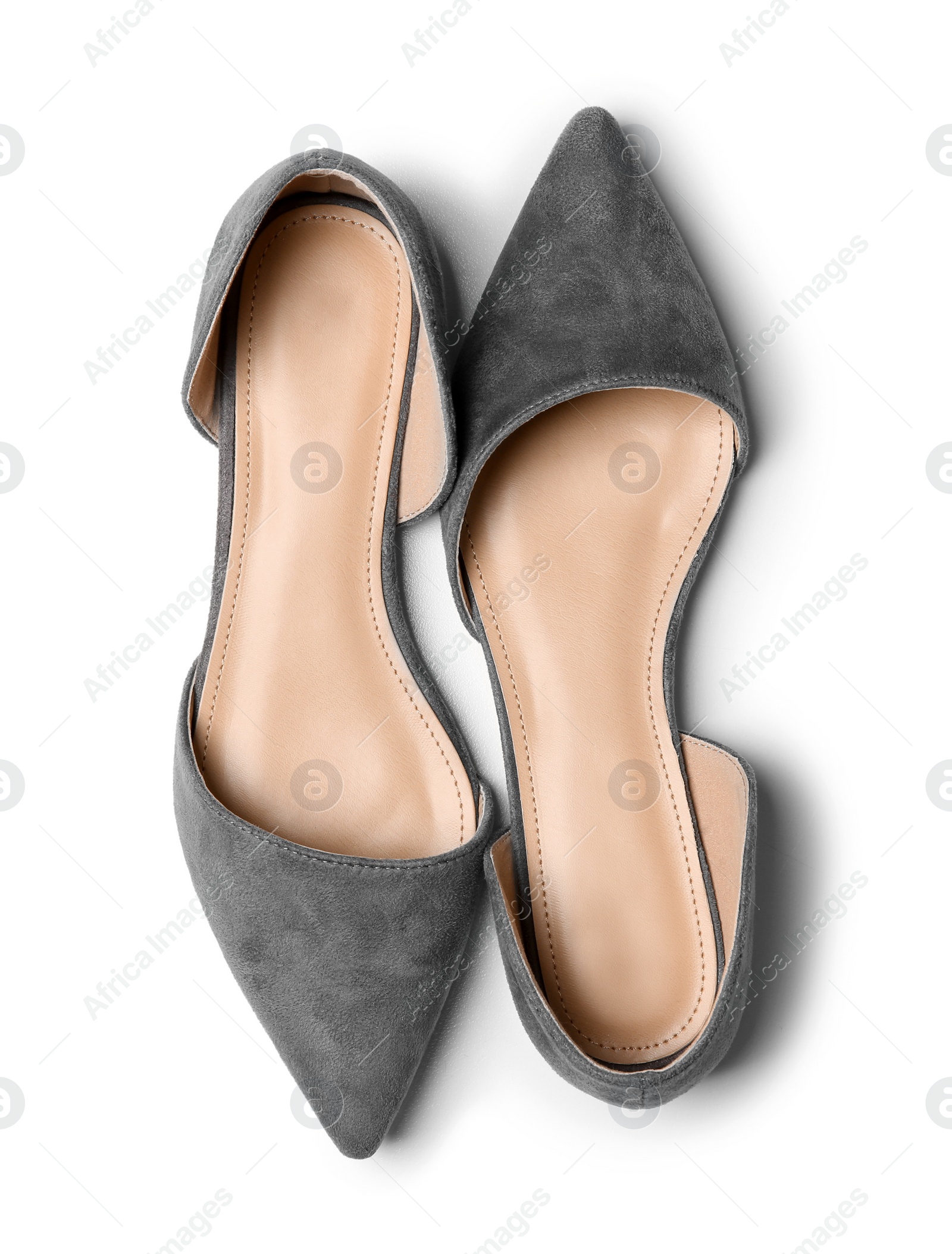 Photo of Pair of female shoes on white background