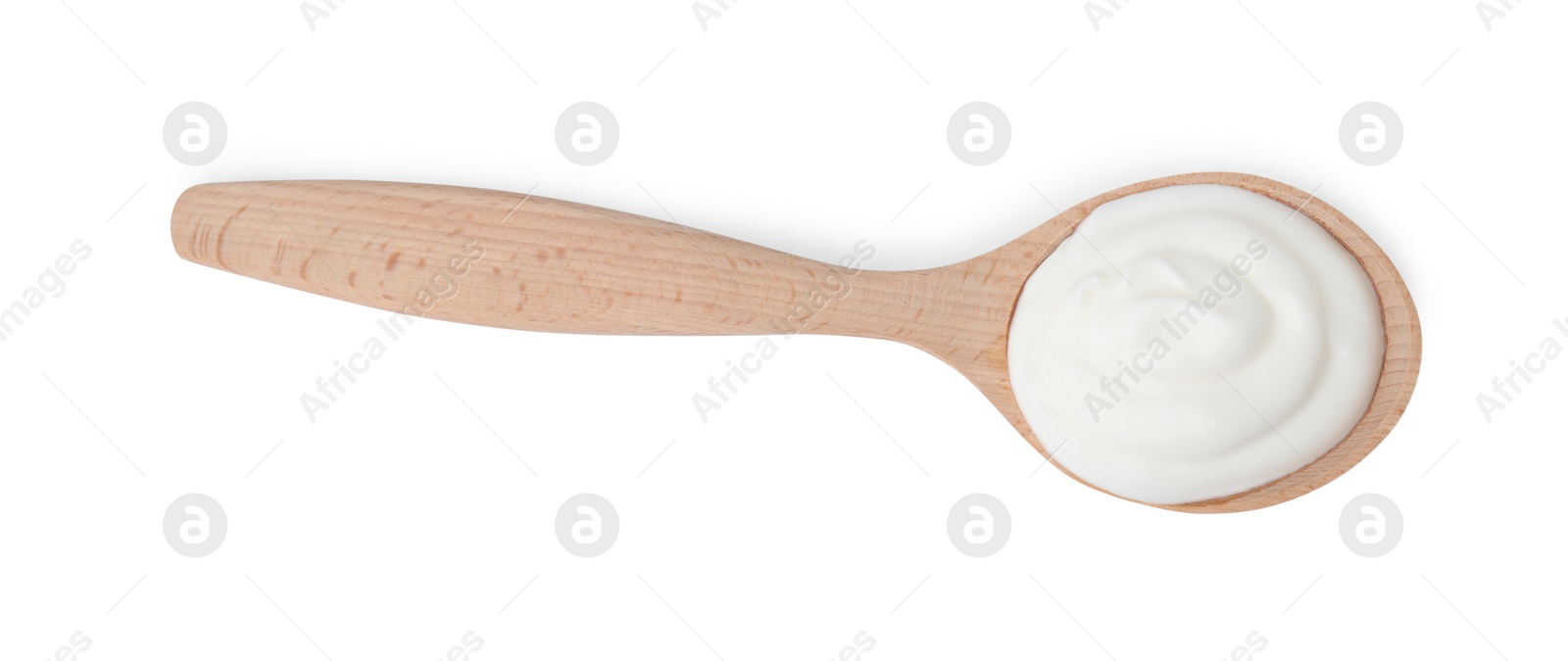 Photo of Delicious natural yogurt in spoon isolated on white, top view