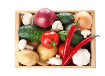 Photo of Wooden crate full of fresh vegetables on white background, top view