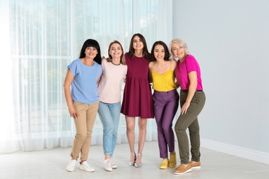 Photo of Group of ladies near window indoors. Women power concept