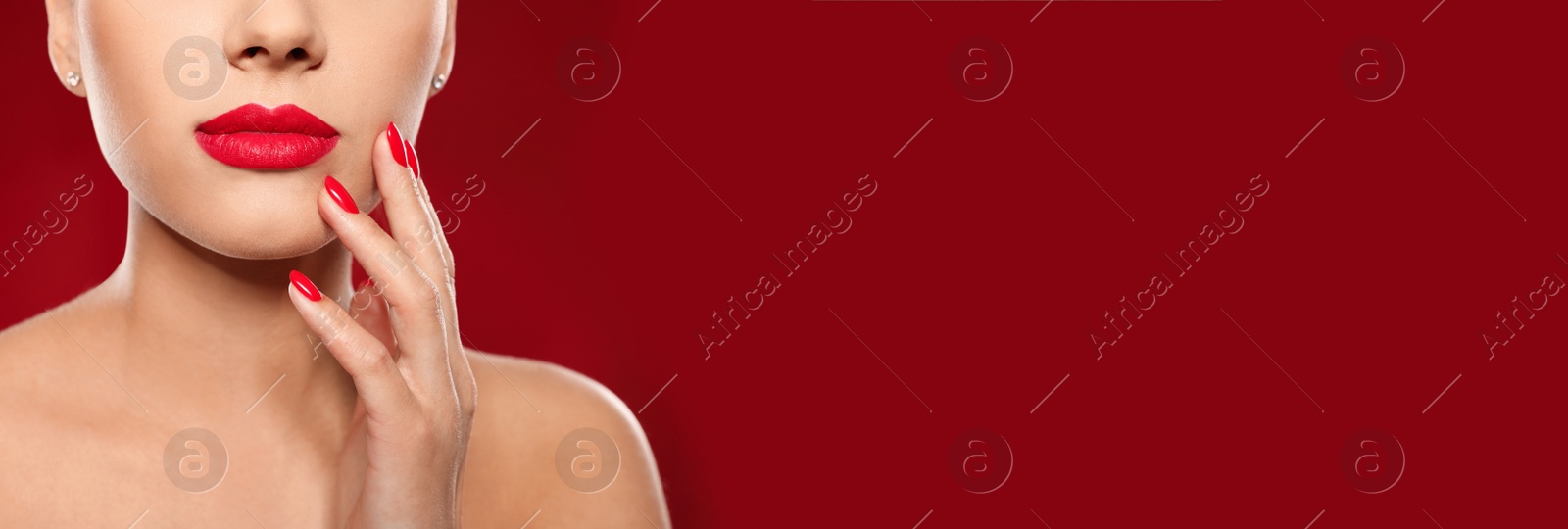 Image of Woman with beautiful lips on red background, closeup view with space for text. Banner design