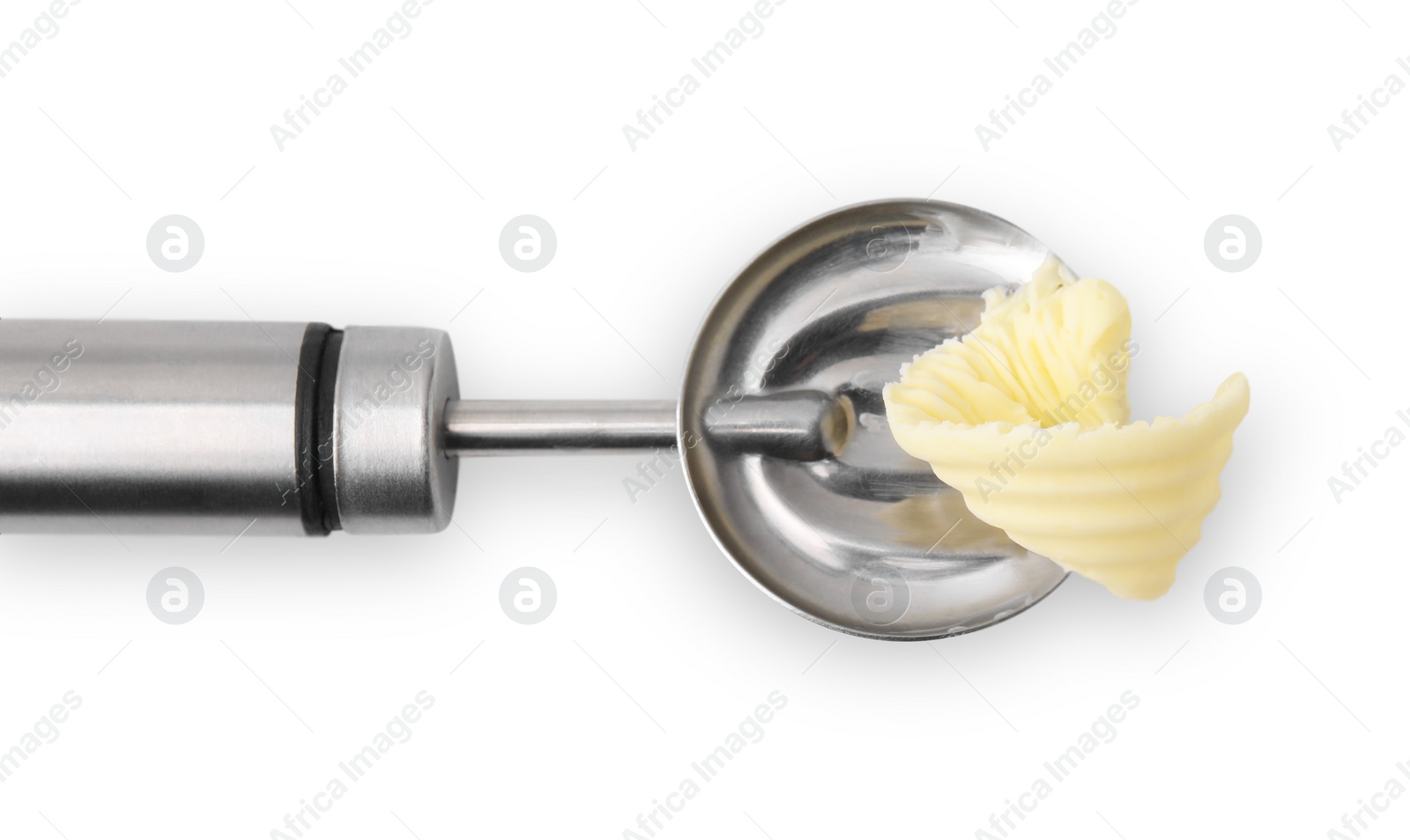 Photo of Butter curl in spoon isolated on white, top view
