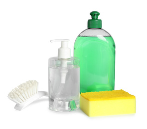 Photo of Detergents, brush and sponge on white background