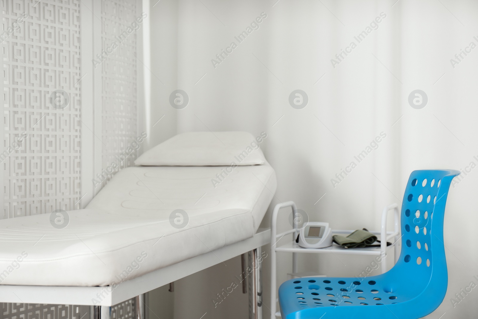 Photo of Empty examination couch in modern medical office