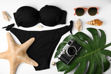 Flat lay composition with different beach objects on white background