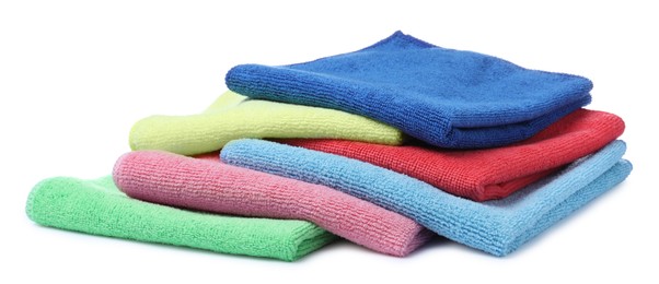 Photo of Many colorful microfiber cloths on white background