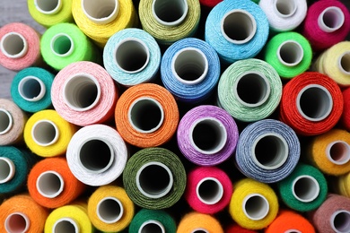 Photo of Different sewing threads as background