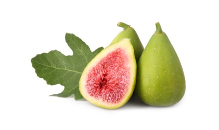 Cut and whole green figs with leaf isolated on white