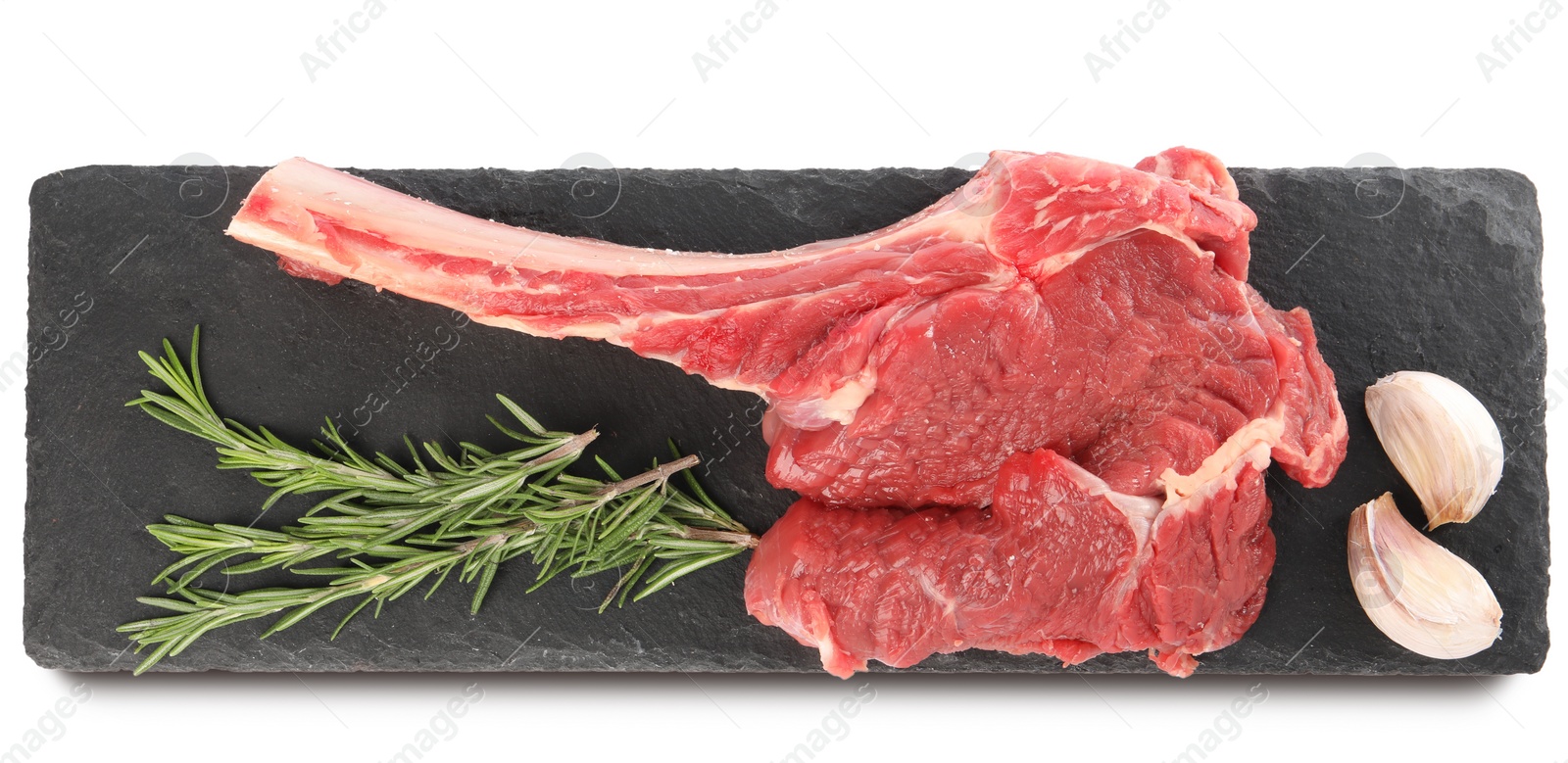 Photo of Raw ribeye steak and spices isolated on white, top view