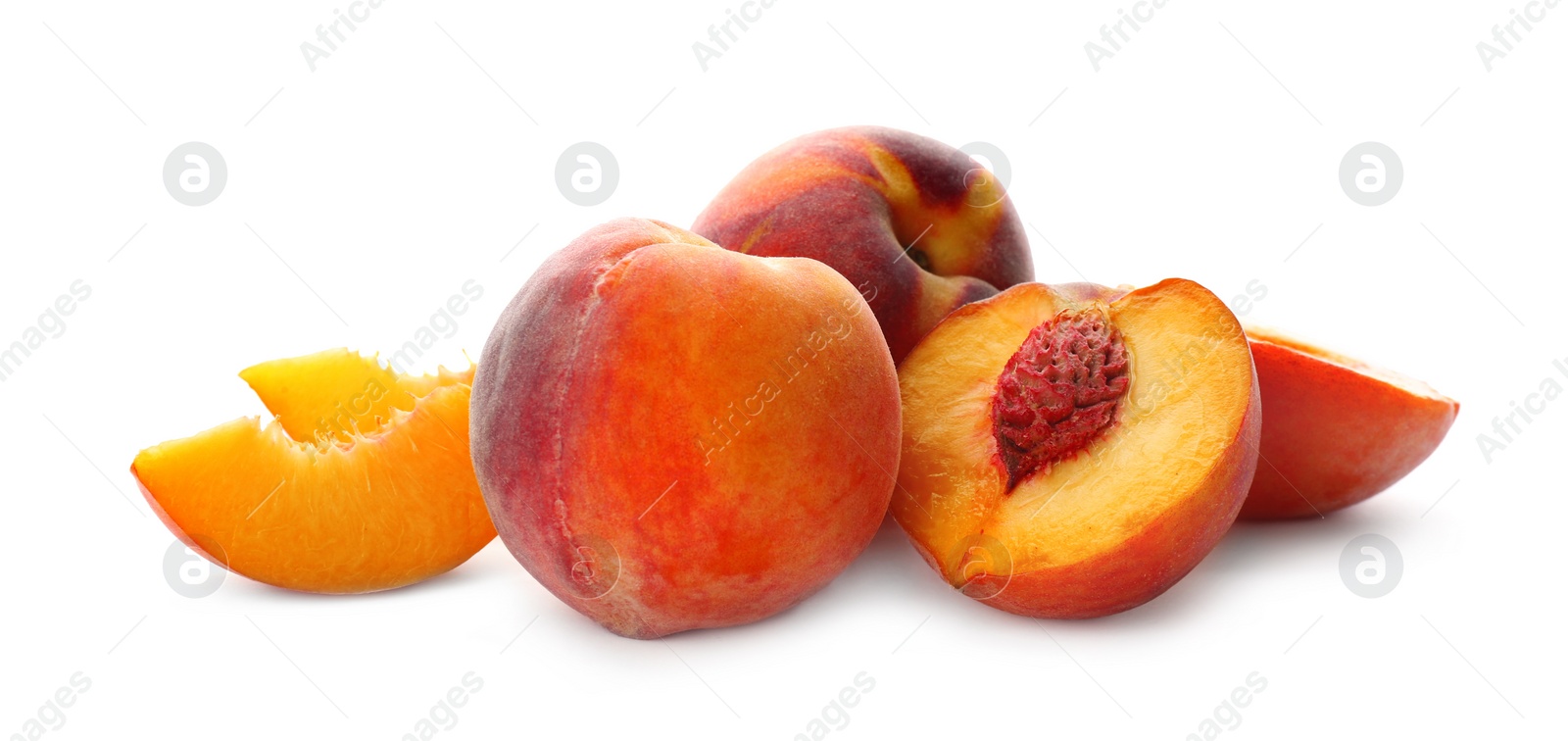 Photo of Whole and cut ripe peaches isolated on white