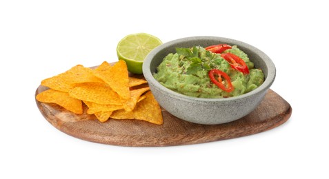 Bowl of delicious guacamole, lime and nachos chips isolated on white