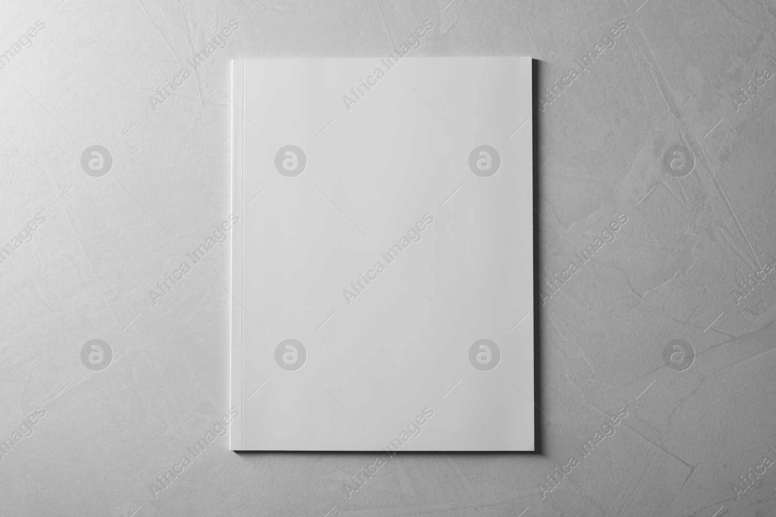 Photo of Blank paper sheets on grey textured background, top view. Mockup for design