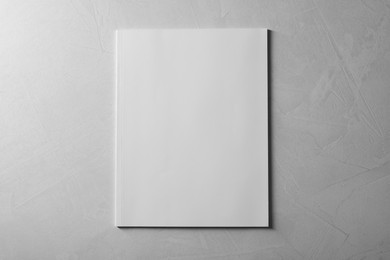 Blank paper sheets on grey textured background, top view. Mockup for design