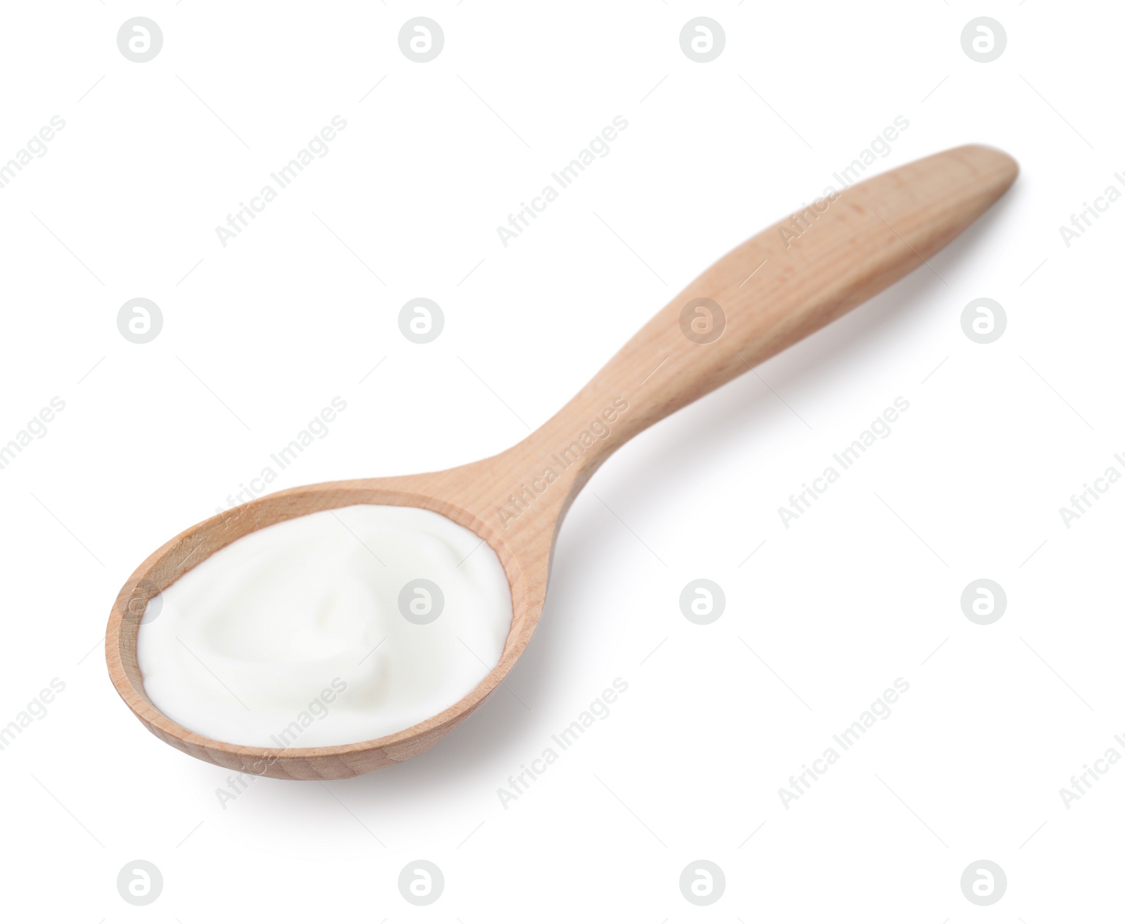 Photo of Delicious natural yogurt in wooden spoon isolated on white