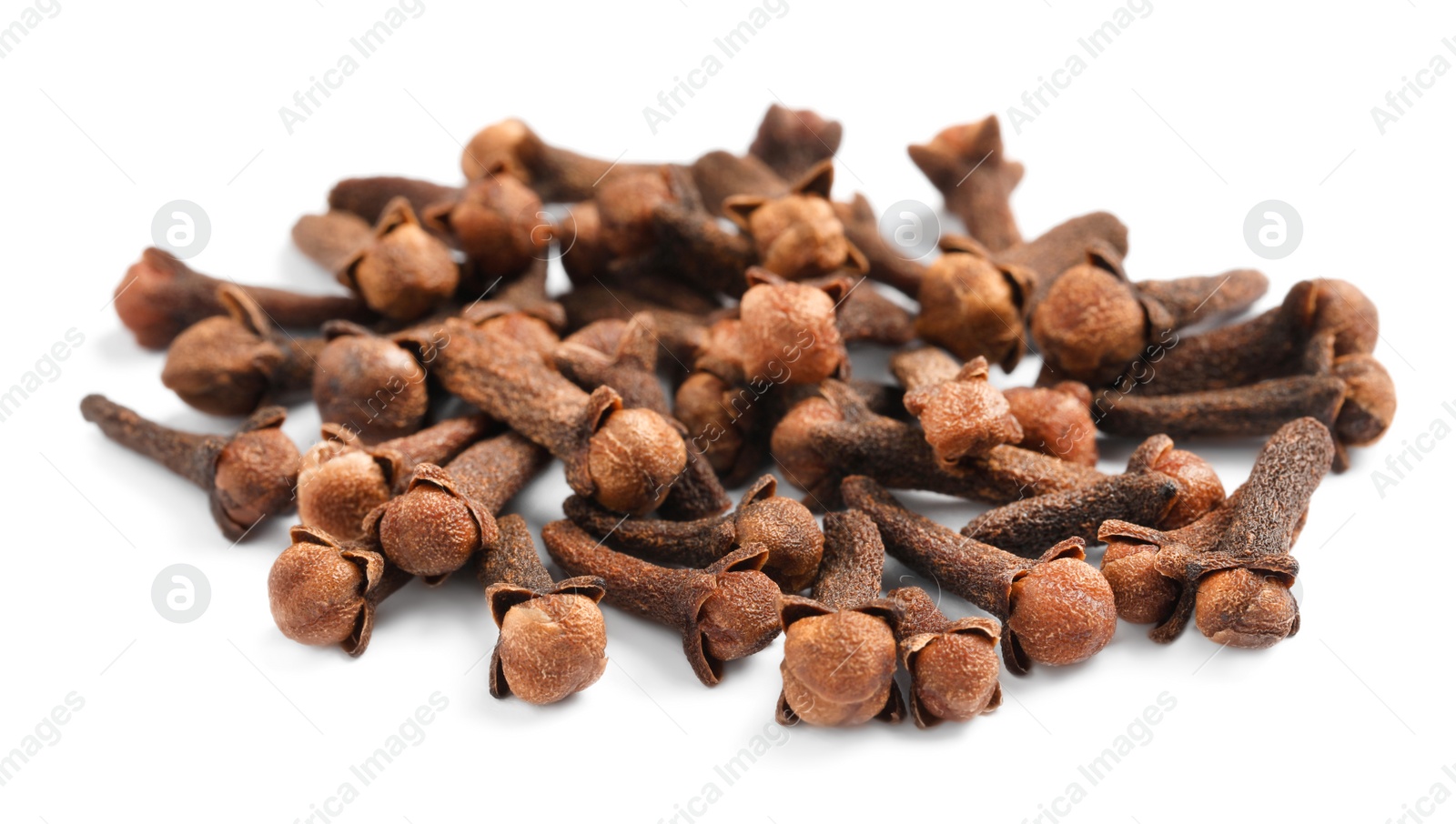 Photo of Pile of aromatic dry cloves on white background