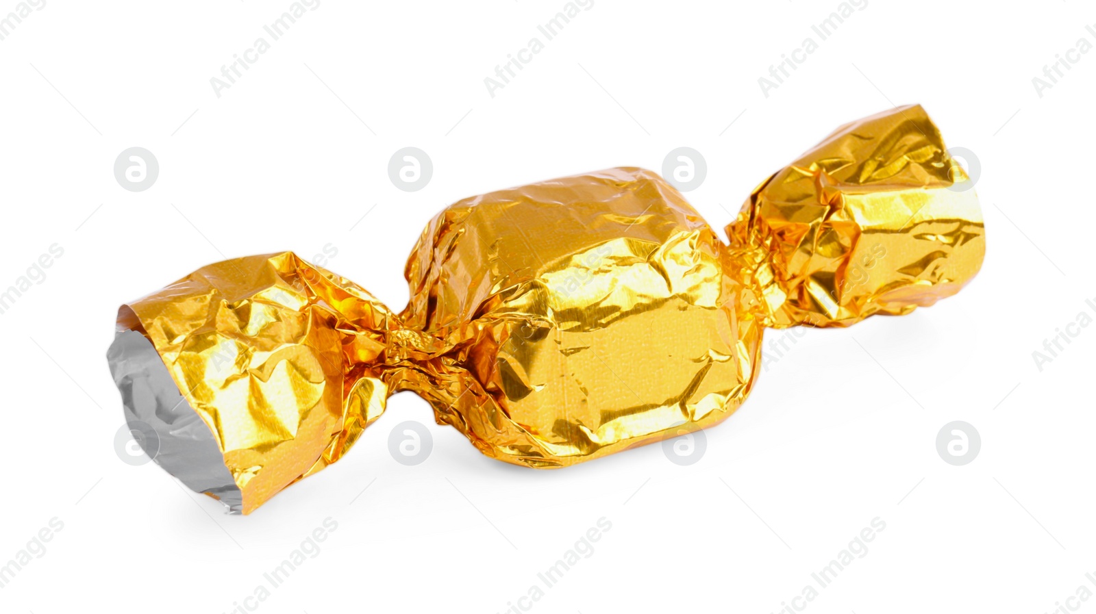 Photo of Tasty candy in yellow wrapper isolated on white