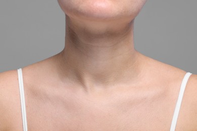 Photo of Closeup view of woman with normal skin on grey background