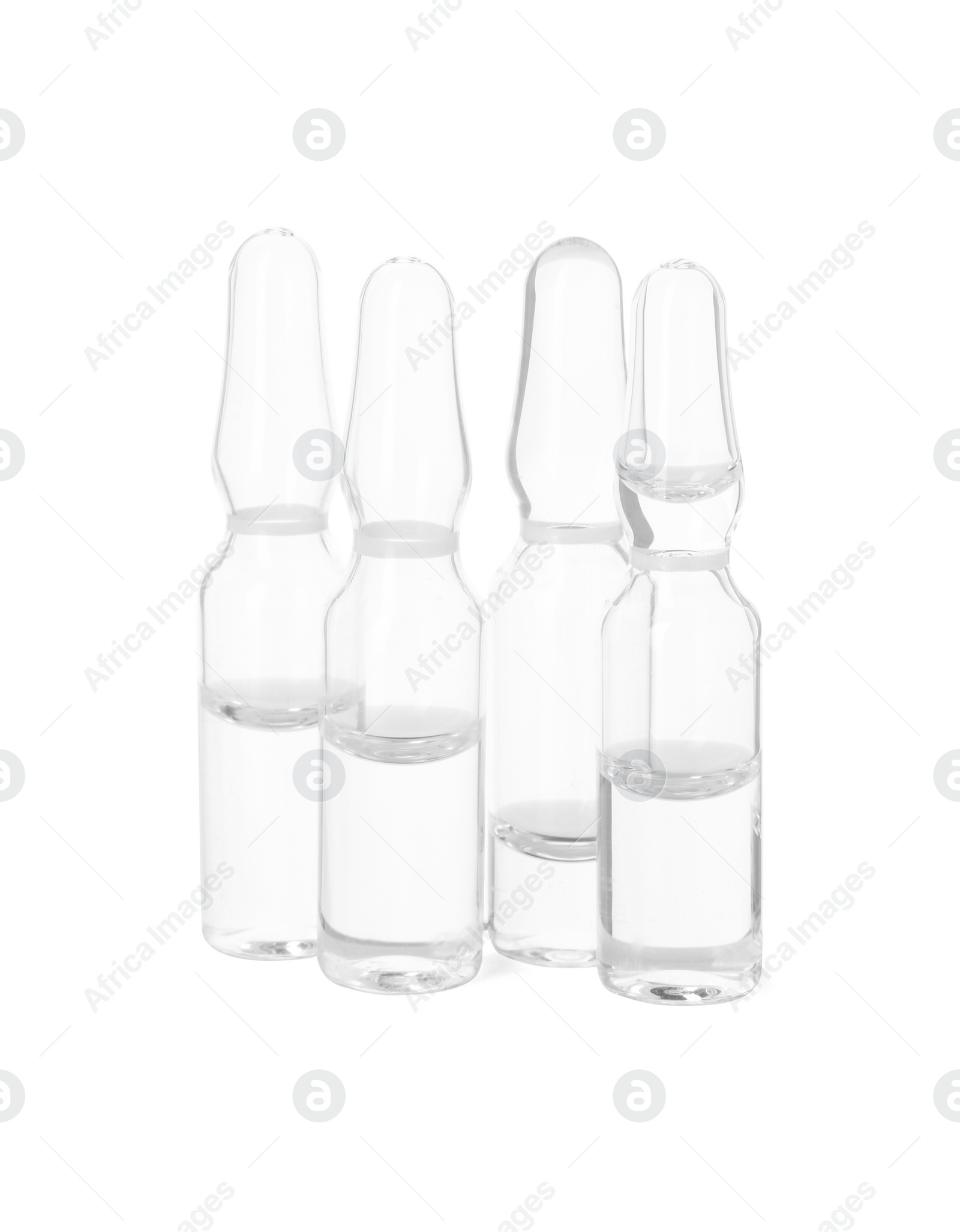 Photo of Glass ampoules with liquid isolated on white