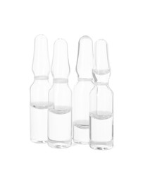 Photo of Glass ampoules with liquid isolated on white