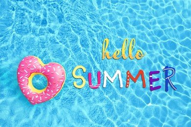 Image of Hello Summer. Swimming pool with inflatable ring, top view