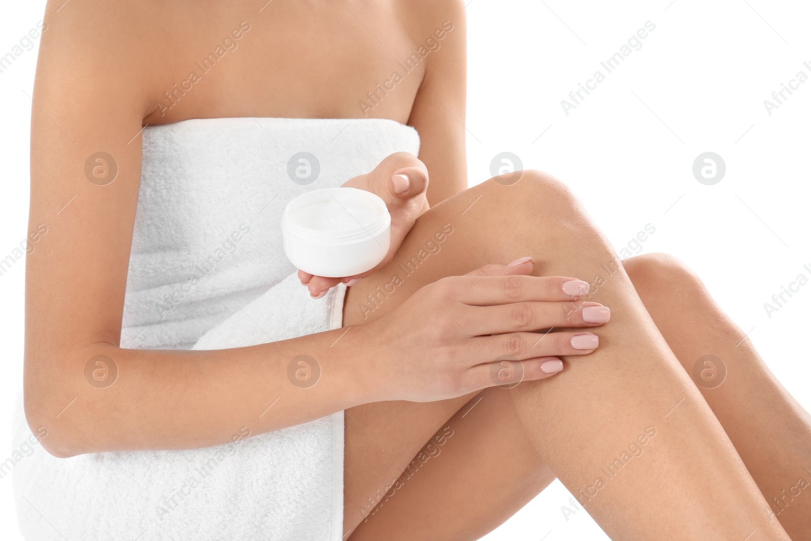 Photo of Young woman with jar of cream on white background, closeup. Beauty and body care