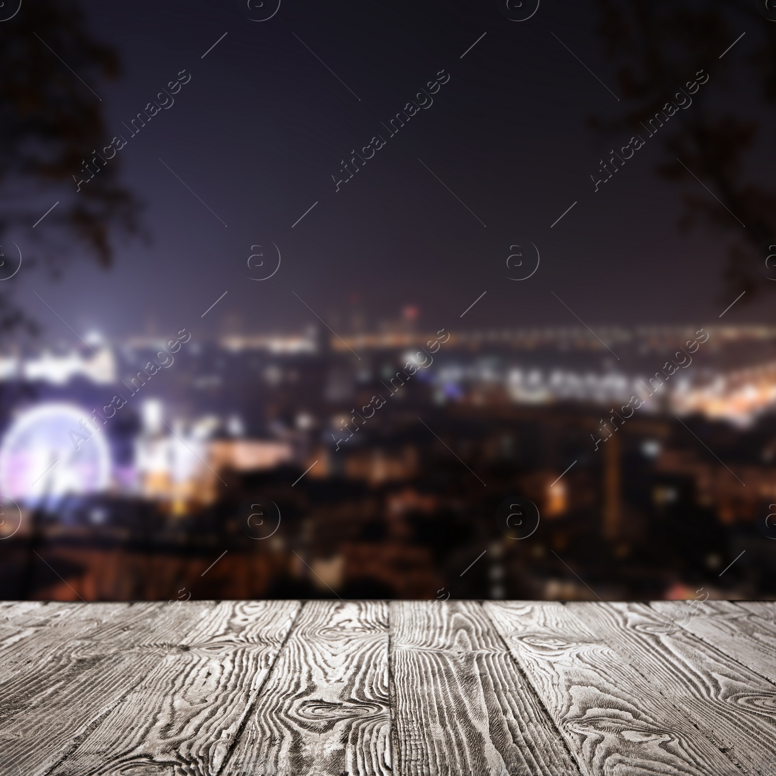 Image of Empty wooden surface and blurred view of modern night city. Bokeh effect 