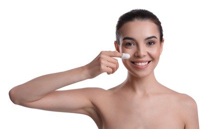 Photo of Woman using silkworm cocoon in skin care routine on white background