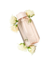 Photo of Bottle of micellar cleansing water and flowers on white background, top view