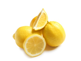 Ripe whole and sliced lemons on white background