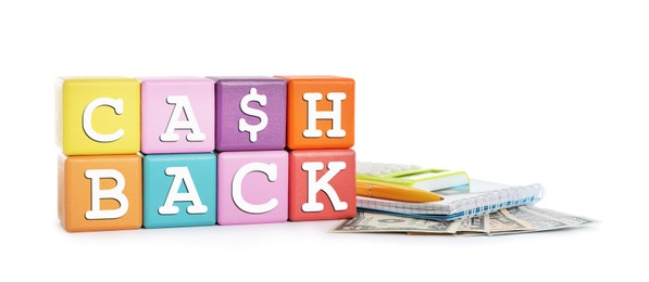 Photo of Colorful cubes with word Cashback, money, calculator and notebook on white background