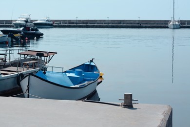 Beautiful view of city pier with moored boats on sunny day