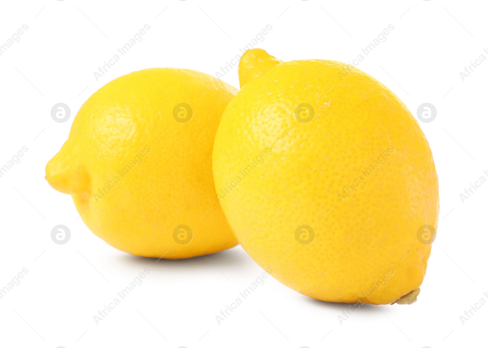 Photo of Two fresh ripe lemons isolated on white