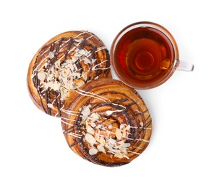 Photo of Delicious rolls with toppings, almond and cuptea isolated on white, top view. Sweet buns