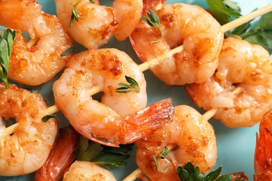 Photo of Skewers with delicious fried shrimps, closeup