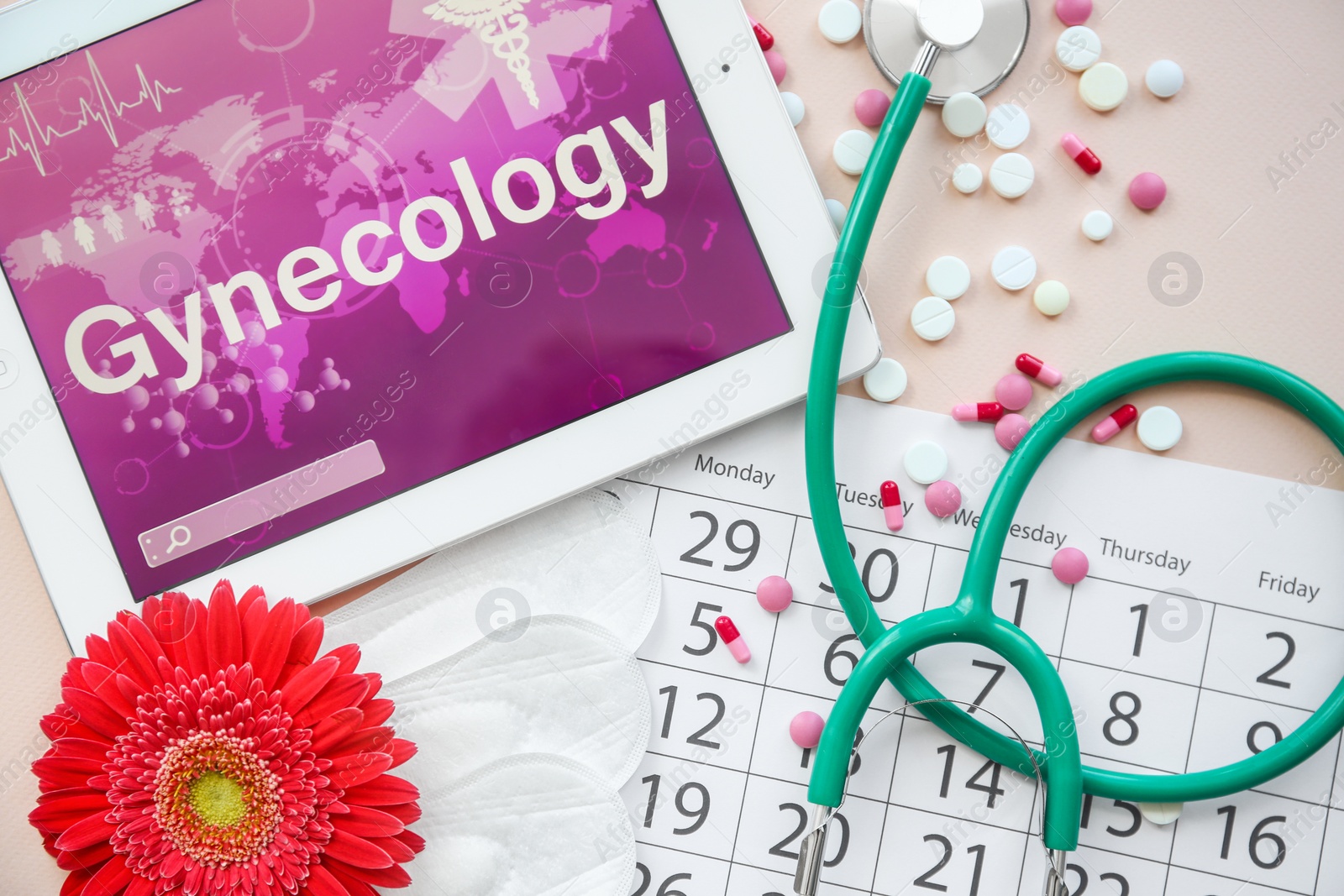 Photo of Flat lay composition with stethoscope, tablet and calendar on color background. Gynecological checkup