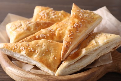 Delicious puff pastry on table, closeup view