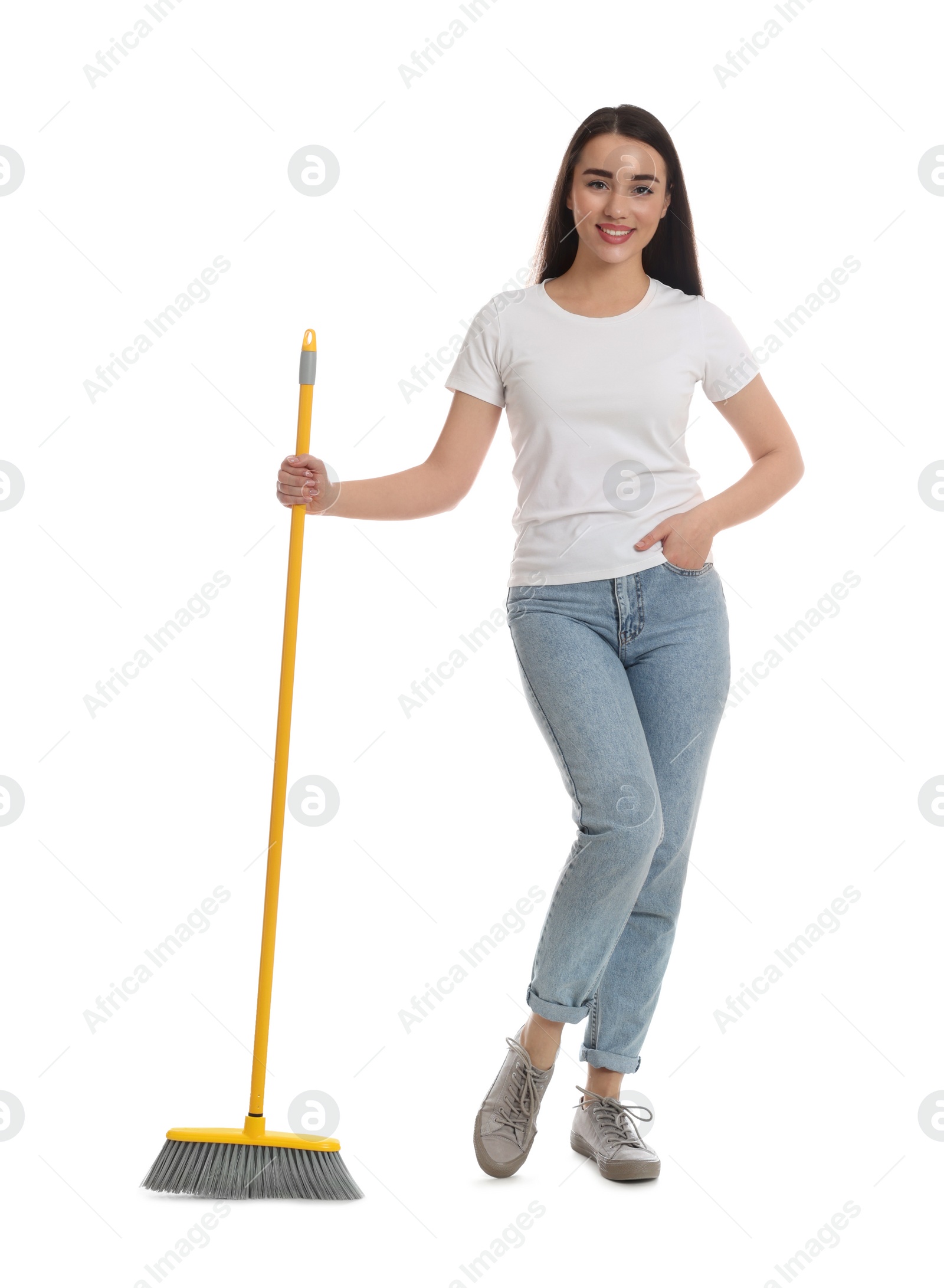 Photo of Beautiful young woman with broom on white background