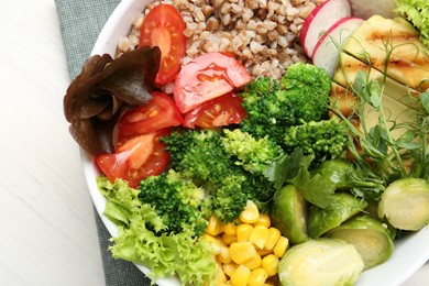 Healthy meal. Tasty products in bowl on white table, top view